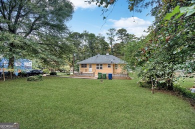 Step into this delightful home brimming with character and ready on Alfred Tup Holmes Golf Course in Georgia - for sale on GolfHomes.com, golf home, golf lot