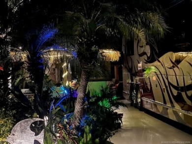 YOUR TROPICAL OASIS AWAITS! Ideally situated near the north on Motorcoach Resort Golf Course in Florida - for sale on GolfHomes.com, golf home, golf lot