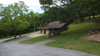 Nestled among impressive oaks and pines this beautifully on Oakridge Golf Course in Arkansas - for sale on GolfHomes.com, golf home, golf lot