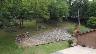 Nestled among impressive oaks and pines this beautifully on Oakridge Golf Course in Arkansas - for sale on GolfHomes.com, golf home, golf lot