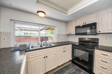 Single-story 3-bedroom, 2-bath, 2-car garage home in the Beacon on Beacon Woods Golf Club in Florida - for sale on GolfHomes.com, golf home, golf lot