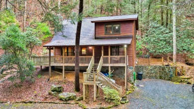 Nature abounds at this furnished cabin nestled on the banks of on White Path Golf Club in Georgia - for sale on GolfHomes.com, golf home, golf lot