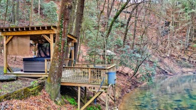 Nature abounds at this furnished cabin nestled on the banks of on White Path Golf Club in Georgia - for sale on GolfHomes.com, golf home, golf lot