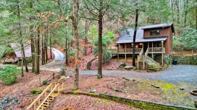 Nature abounds at this furnished cabin nestled on the banks of on White Path Golf Club in Georgia - for sale on GolfHomes.com, golf home, golf lot