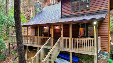 Nature abounds at this furnished cabin nestled on the banks of on White Path Golf Club in Georgia - for sale on GolfHomes.com, golf home, golf lot