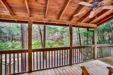 Nature abounds at this furnished cabin nestled on the banks of on White Path Golf Club in Georgia - for sale on GolfHomes.com, golf home, golf lot