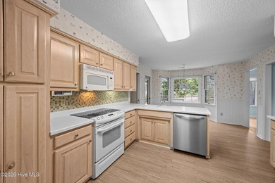 This beautiful brick home is ideally positioned on Fairfield on Harbour Point Golf Club in North Carolina - for sale on GolfHomes.com, golf home, golf lot