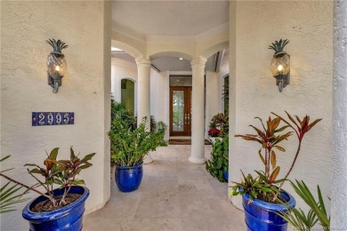 Experience the luxury and elegance of this Sailfish Point estate on Sailfish Point Golf Club, Inc. in Florida - for sale on GolfHomes.com, golf home, golf lot