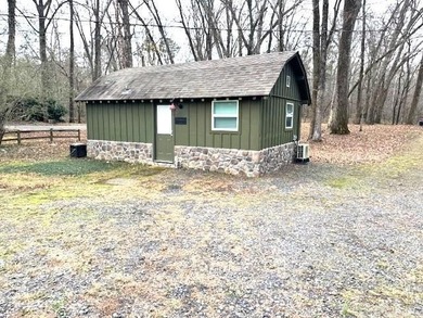 Enjoy the serenity of the Little Red River in this masterfully on Lost Creek Golf Club in Arkansas - for sale on GolfHomes.com, golf home, golf lot