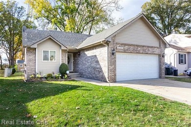 Enjoy the convenience of single level living in this beautiful on St. Clair Shores Country Club in Michigan - for sale on GolfHomes.com, golf home, golf lot