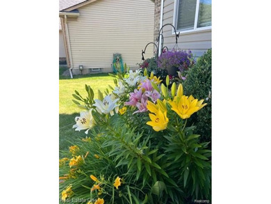 Enjoy the convenience of single level living in this beautiful on St. Clair Shores Country Club in Michigan - for sale on GolfHomes.com, golf home, golf lot