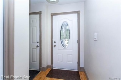 Enjoy the convenience of single level living in this beautiful on St. Clair Shores Country Club in Michigan - for sale on GolfHomes.com, golf home, golf lot