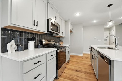 Experience the *Lily*, where modern elegance meets effortless on Golf Club of Creekmoor in Missouri - for sale on GolfHomes.com, golf home, golf lot