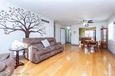 Enjoy the convenience of single level living in this beautiful on St. Clair Shores Country Club in Michigan - for sale on GolfHomes.com, golf home, golf lot