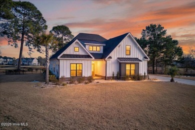 Step inside this luxury modern coastal craftsman home, perfectly on Sea Trail Golf Resort in North Carolina - for sale on GolfHomes.com, golf home, golf lot