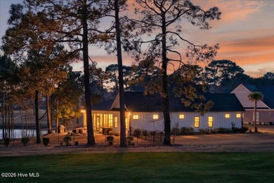 Step inside this luxury modern coastal craftsman home, perfectly on Sea Trail Golf Resort in North Carolina - for sale on GolfHomes.com, golf home, golf lot