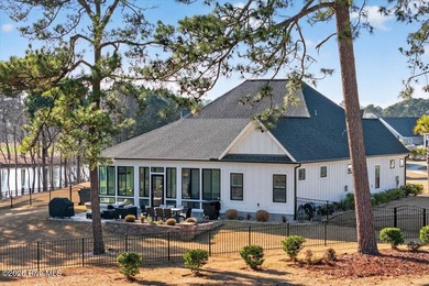 Step inside this luxury modern coastal craftsman home, perfectly on Sea Trail Golf Resort in North Carolina - for sale on GolfHomes.com, golf home, golf lot