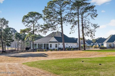 Step inside this luxury modern coastal craftsman home, perfectly on Sea Trail Golf Resort in North Carolina - for sale on GolfHomes.com, golf home, golf lot