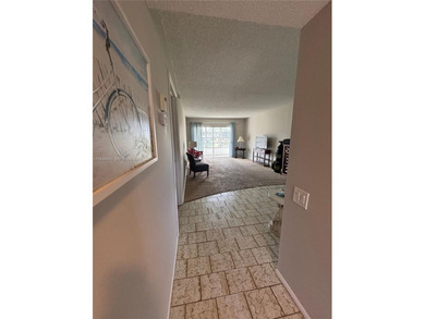 Welcome to resort-style living in this beautifully maintained on Wynmoor Golf Course in Florida - for sale on GolfHomes.com, golf home, golf lot