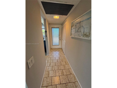 Welcome to resort-style living in this beautifully maintained on Wynmoor Golf Course in Florida - for sale on GolfHomes.com, golf home, golf lot