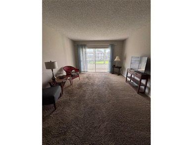 Welcome to resort-style living in this beautifully maintained on Wynmoor Golf Course in Florida - for sale on GolfHomes.com, golf home, golf lot