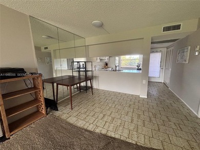 Welcome to resort-style living in this beautifully maintained on Wynmoor Golf Course in Florida - for sale on GolfHomes.com, golf home, golf lot