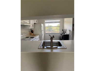 Welcome to resort-style living in this beautifully maintained on Wynmoor Golf Course in Florida - for sale on GolfHomes.com, golf home, golf lot