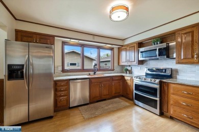 This beautifully maintained 4-bedroom, 3-bathroom home is on Virginia Golf Course in Minnesota - for sale on GolfHomes.com, golf home, golf lot
