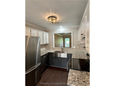 Absolute darling townhome tucked along #12 green @King's Grant on Kings Grant Golf and Country Club in North Carolina - for sale on GolfHomes.com, golf home, golf lot
