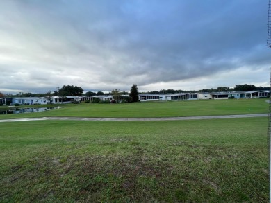 2 bed | 2 bath | 1248 sq ft | Lot 209 | $49,900    She's got on Lake Henry Golf Club in Florida - for sale on GolfHomes.com, golf home, golf lot