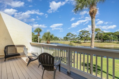 Beautiful lakefront condo just steps from the entrance to on Suntree Country Club in Florida - for sale on GolfHomes.com, golf home, golf lot