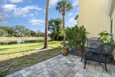 Beautiful lakefront condo just steps from the entrance to on Suntree Country Club in Florida - for sale on GolfHomes.com, golf home, golf lot