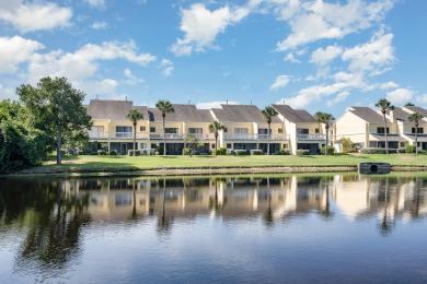 Beautiful lakefront condo just steps from the entrance to on Suntree Country Club in Florida - for sale on GolfHomes.com, golf home, golf lot