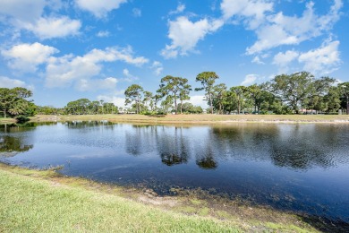 Beautiful lakefront condo just steps from the entrance to on Suntree Country Club in Florida - for sale on GolfHomes.com, golf home, golf lot