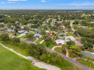 Located across from Hole 8 of the St. Petersburg Country Club on St. Petersburg Country Club in Florida - for sale on GolfHomes.com, golf home, golf lot