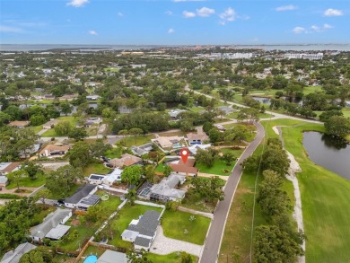 Located across from Hole 8 of the St. Petersburg Country Club on St. Petersburg Country Club in Florida - for sale on GolfHomes.com, golf home, golf lot