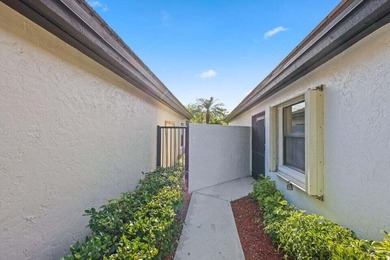 Discover the perfect blend of comfort and convenience within the on PGA National Golf Club in Florida - for sale on GolfHomes.com, golf home, golf lot