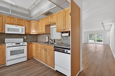 ASSOC REQUIRES 20% DOWN & 1 OCCUP 55+ VACANT/CLICK ON SHOWING on Wynmoor Golf Course in Florida - for sale on GolfHomes.com, golf home, golf lot