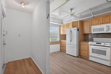 ASSOC REQUIRES 20% DOWN & 1 OCCUP 55+ VACANT/CLICK ON SHOWING on Wynmoor Golf Course in Florida - for sale on GolfHomes.com, golf home, golf lot