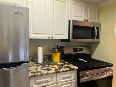 Not just another condo. This tastefully modern, affordable, low on Largo Golf Course in Florida - for sale on GolfHomes.com, golf home, golf lot