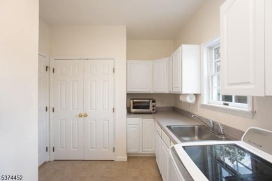 Welcome to this sun-filled 4-bedroom Colonial backing to the on Warrenbrook Golf Course in New Jersey - for sale on GolfHomes.com, golf home, golf lot
