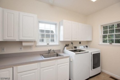 Welcome to this sun-filled 4-bedroom Colonial backing to the on Warrenbrook Golf Course in New Jersey - for sale on GolfHomes.com, golf home, golf lot