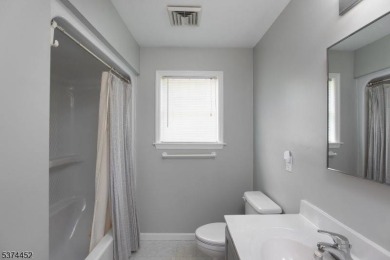Welcome to this sun-filled 4-bedroom Colonial backing to the on Warrenbrook Golf Course in New Jersey - for sale on GolfHomes.com, golf home, golf lot