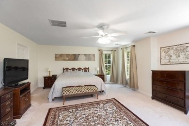 Welcome to this sun-filled 4-bedroom Colonial backing to the on Warrenbrook Golf Course in New Jersey - for sale on GolfHomes.com, golf home, golf lot
