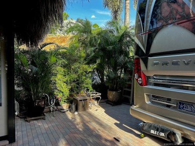 Discover the perfect combination of privacy, space, and luxury on Motorcoach Resort Golf Course in Florida - for sale on GolfHomes.com, golf home, golf lot