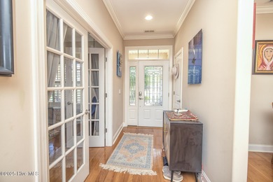 Welcome to effortless, single-level living in the highly on Cape Fear National At Brunswick Forest in North Carolina - for sale on GolfHomes.com, golf home, golf lot