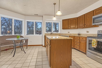 Discover the perfect blend of comfort and elegance in this on Oak Hills Country Club in Illinois - for sale on GolfHomes.com, golf home, golf lot