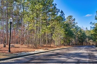 Level golf front home site is gently wooded with lovely tree on Forest Creek Golf Club  in North Carolina - for sale on GolfHomes.com, golf home, golf lot