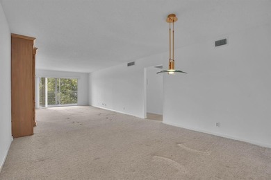 Corner residence offering stunning water views from every window on Wynmoor Golf Course in Florida - for sale on GolfHomes.com, golf home, golf lot