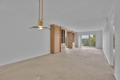 Corner residence offering stunning water views from every window on Wynmoor Golf Course in Florida - for sale on GolfHomes.com, golf home, golf lot